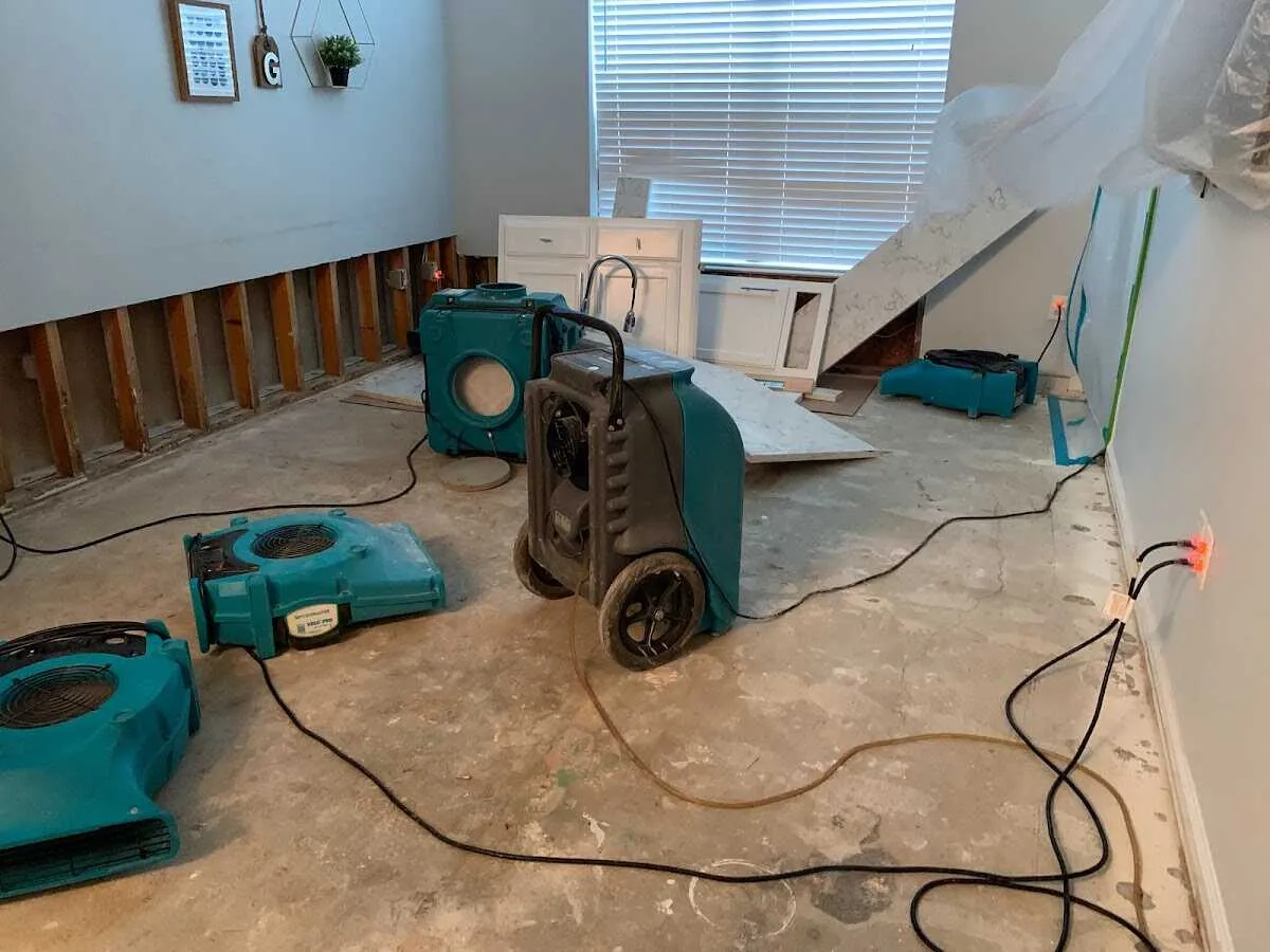 Dehumidifier in flood-cut room for Water Damage Restoration in Kennett